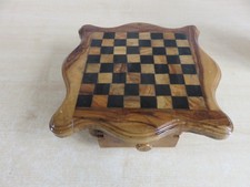 Small chess set on legs with Roman / Greek pieces.