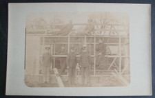WW1 RPPC MILITARY BRITISH SOLDIERS BUILDING WOODEN HUT DOG MASCOT WITH MEN