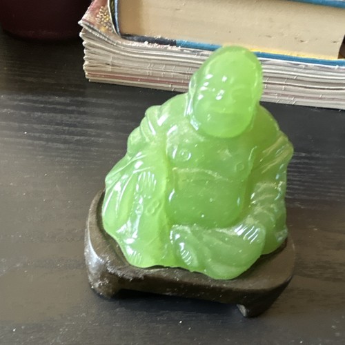 Green carved stone - carved, laughing