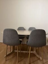 oval Shaped Wooden dining table and 4 chairs