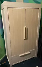Double white wooden wardrobe with interior shelf and drawer at bottom