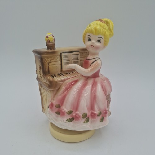 Vintage girl playing piano