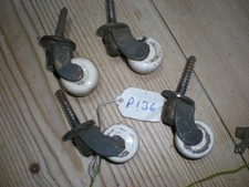 4 BRASS & WHITE PORCLIAN CASTORS
