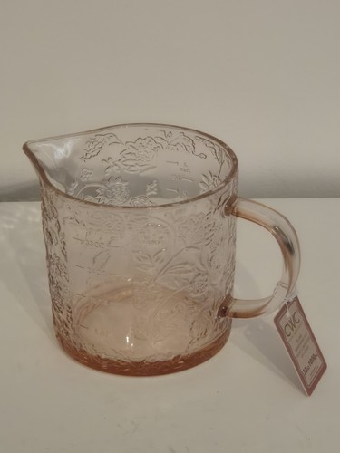 Measuring jug with - , embossed