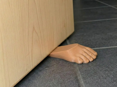 Foot shaped door stop - stop, —