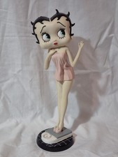 Betty Boop - Wearing Pink Dress, Standing On Bathroom Scales.