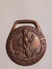 The Cathedral Garage, Bristol copper key fob, running boy and St Christopher