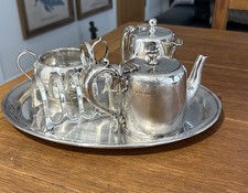 Hardened silver breakfast set, a tray, teapot, water pot sugar bowl and toaster