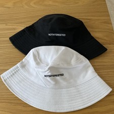 Two NOTINTERESTED   Bucket Golf Hat  one size 1 x Black 1 X White