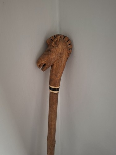 Carved horse head topped - carved,