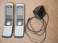 Two Nokia Mobile 2720 Flip Fold Phones And Mains Unit