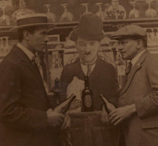 Men Drink Beer in Bottles with