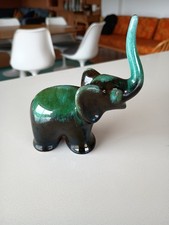 Green Elephant calf trunk up