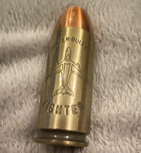 Bullet shaped metal pocket - bullet-shaped,