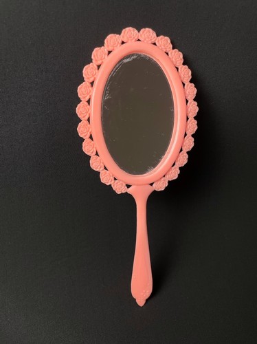 Vintage pink plastic hand held