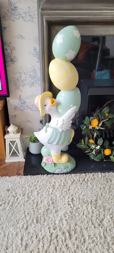 Easter duck figurine features