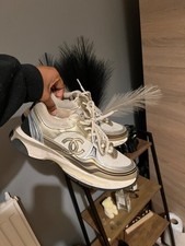 Chanel gold and white trainers