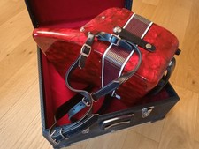 Red accordion for sale good condition, includes original case. 