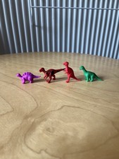 4 Small Toy Plastic Dinosaurs