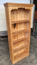 Slim open pine bookcase cornice plinth books