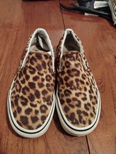 A Pair Of Leopard Print Vans