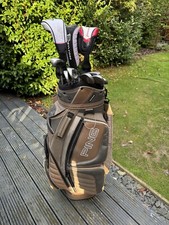 NICE SET OF LADIES YONEX GOLF CLUBS IN A PING CART BAG WITH CALLAWAY DRIVER.