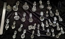 Large quantity of decanter glass stoppers.