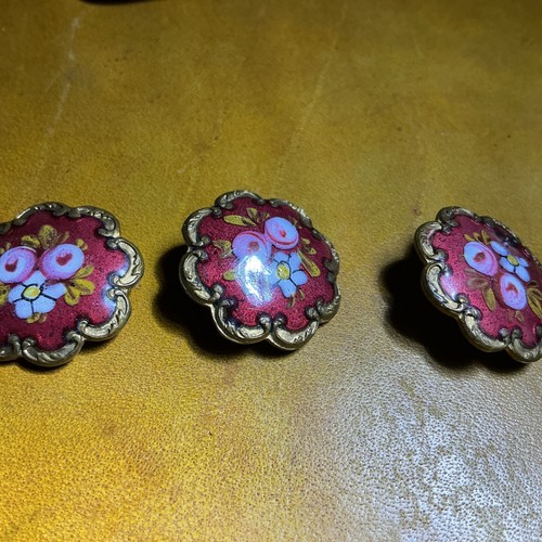 Three antique enamel buttons - three,
