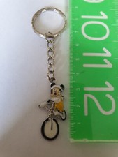 MICKEY MOUSE RIDING A BIKE