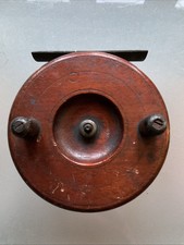 EARLY BRASS STRAPBACK WOODEN FISHING REEL.