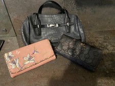 womans grey guess bag with