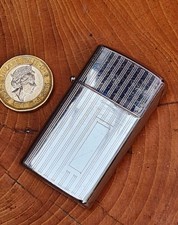 Nice Vintage Continental Of Japan Lift top Petrol Lighter Working Example .