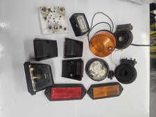 ASSORTED BOX OF NEW USED RUBBOLITE LIGHTS,LENSES AND FITTINGS