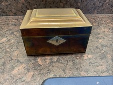 small tin brass box with silver coloured escutcheon