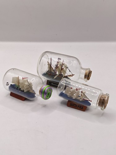Three miniature ship a - three,