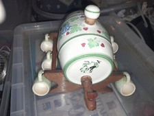 ceramic wine barrel wth grapes/vine leaf decoration on wooden trestle, 6 mugs