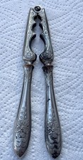 Antique Silver-Plated Nutcrackers With Floral Design