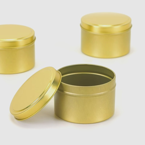 Empty gold candle tins with - gold,