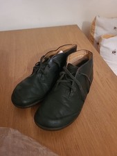 pair of black Clarks leather