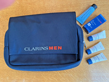 CLARINS FOR MEN TOILETRIES BAG, BRAND NEW, WITH 5 SKINCARE TRAVEL PRODUCTS.