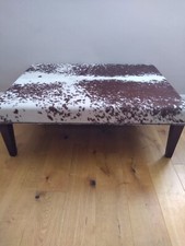 Ottoman/Footstool.  Nearly New. City Cows Brand.  Brown and White Cow Hide.  