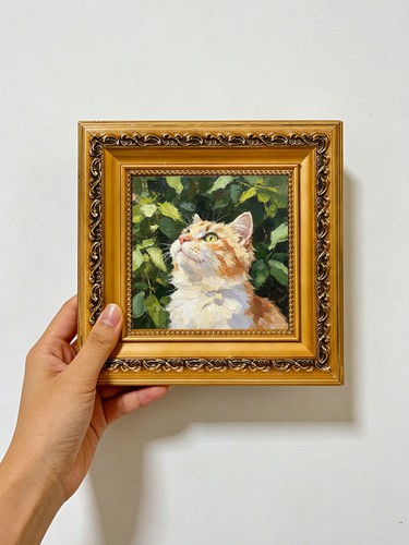 Orange tabby cat green - orange, in