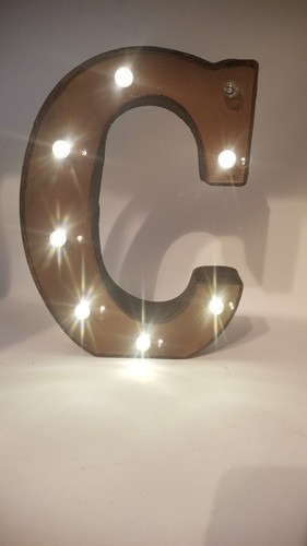 Large brown letter capital - brown, "c"