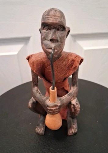 Vtg squatting man - with, gourd