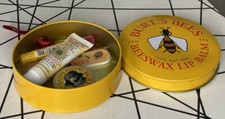Burt's Bee tin with  Lip Shimmer, cleansing cream, hand salve & nail file