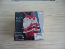 NEXT A SET OF TWO MAGNETIC SANTA TIEBACKS CHRISTMAS CURTAINS TIEBACKS