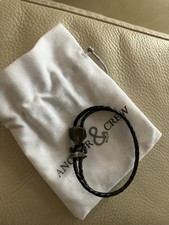Coal black delta anchor silver and braided leather bracelet. Size 19
