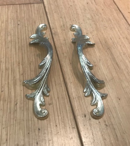 Pair ornate decorative pull - of,