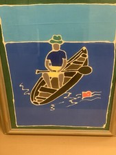 Man on canoe framed painting 
