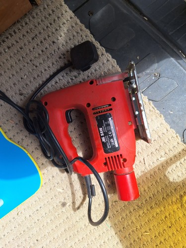 Red corded electric jigsaw - jigsaw, is